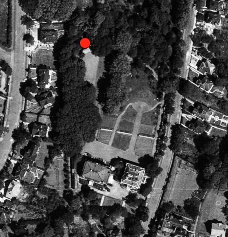 Aerial photograph of the gardens with a red dot marking the grotto