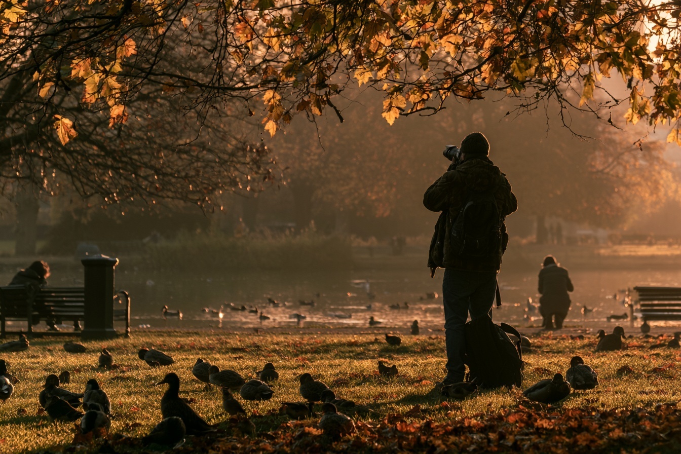 A photographer taking pictures in a park
