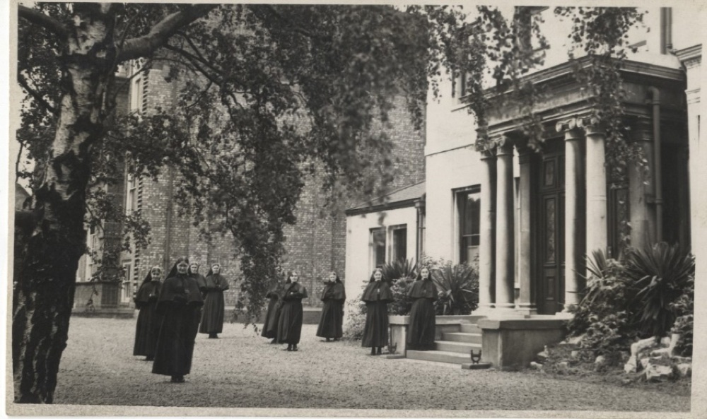 Black and white photograph of nuns standing outside Mycenae House